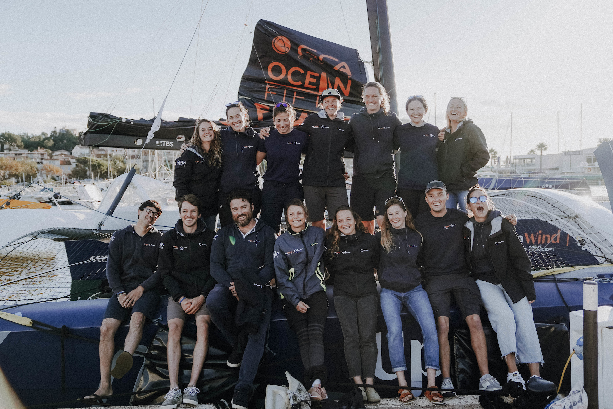 All the UpWind by MerConcept team posing on the trimaran