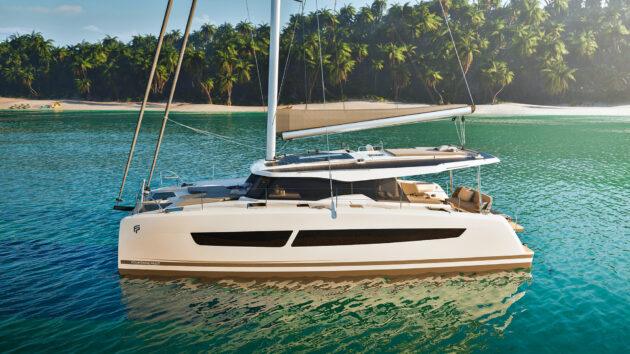 Fountaine Pajot 41 catamaran with sleek design and solar-powered features anchored in a tropical bay with clear turquoise water and palm trees.