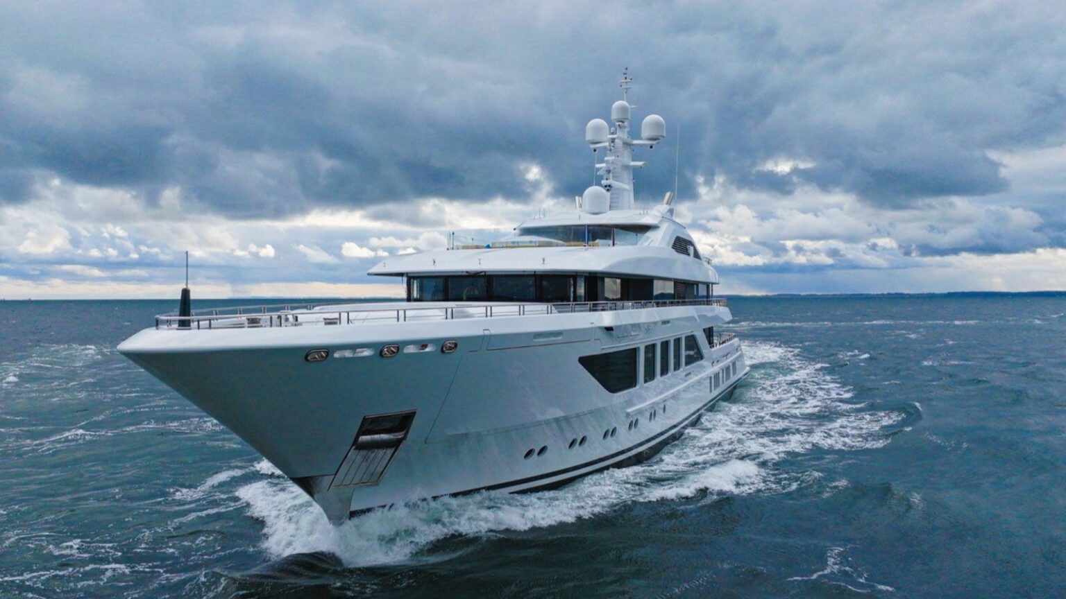 Luxury Nobiskrug yacht undergoing sea trials under cloudy skies, showcasing its modern design and craftsmanship.