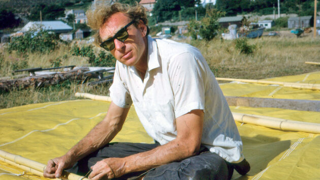 James Wharram working on the sails of a boat