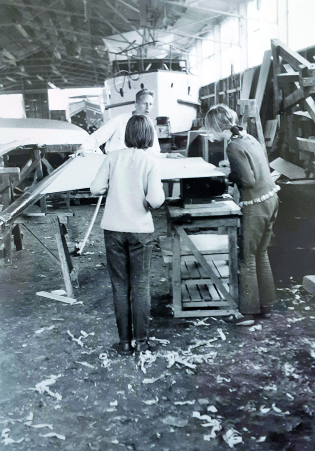 A catamaran being built in a shed