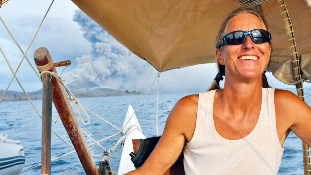 Hanneke Boon at the helm of a boat