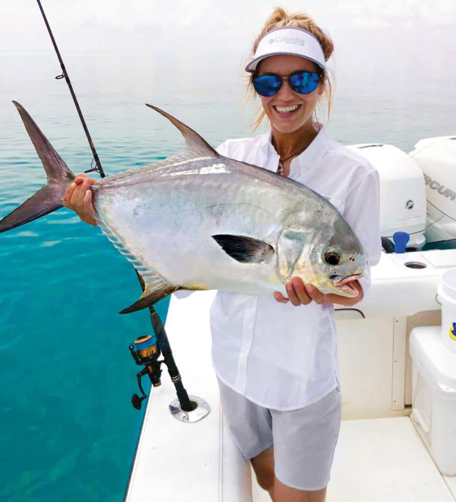 Angler holding a permit